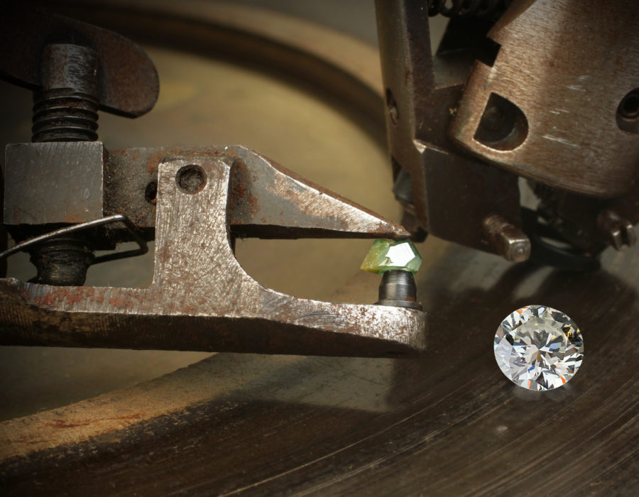 Faceting diamond, big gem with jewelery cutting equipment.